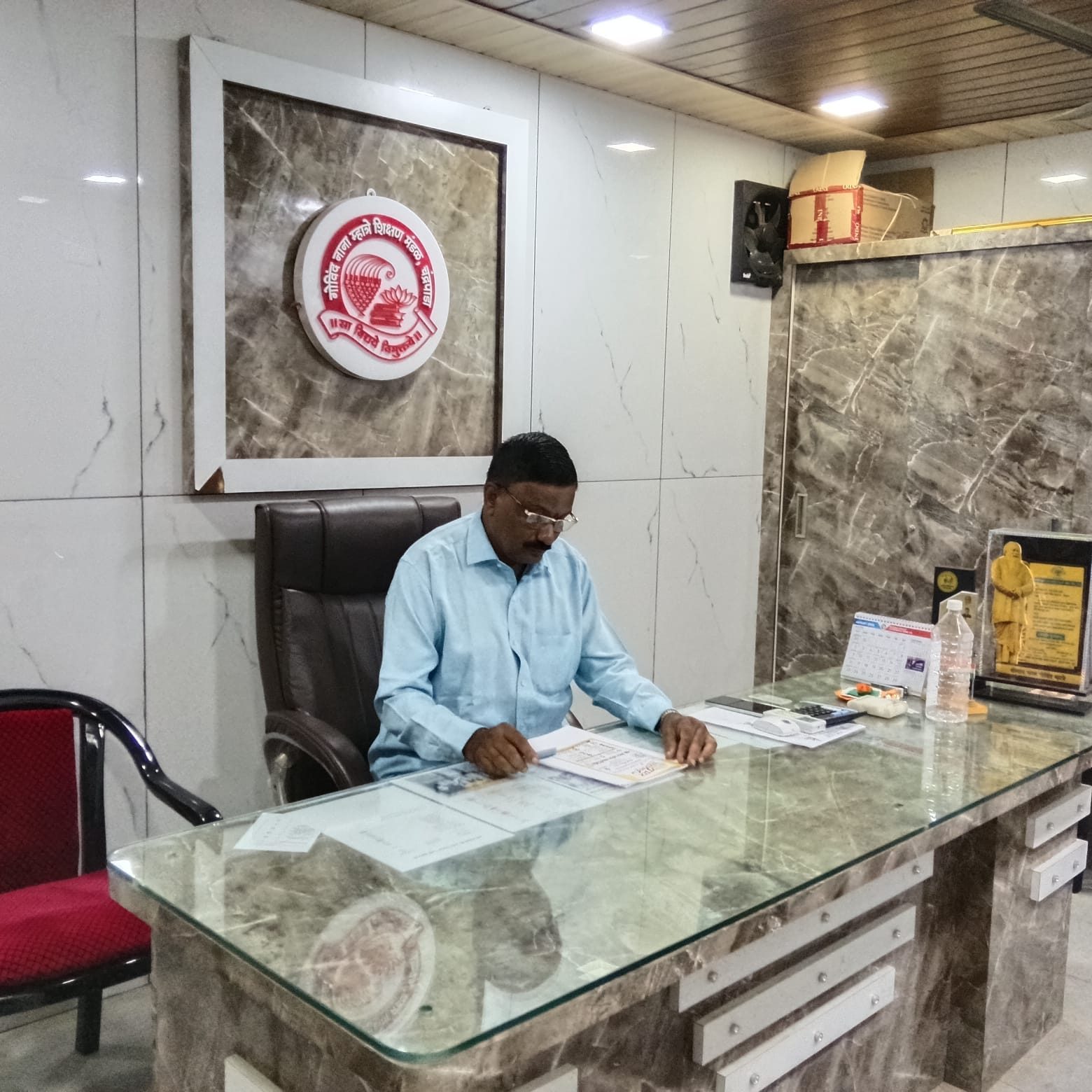 Chairman of Govind Nana Mhatre Education Trust at his office